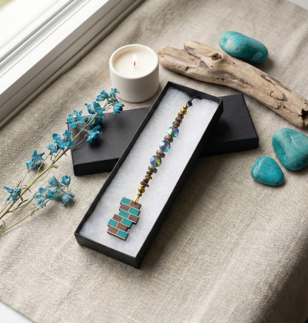 a lifestyle image of PuffCuff charms with a turquoise theme color and light cream background
