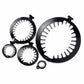 Set of black metal rings with white interior patterns on a white background